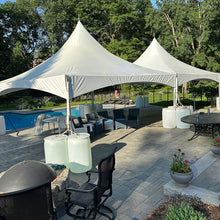 Load image into Gallery viewer, 20x40 High Peak Tent Rental Massachusetts with water barrels on concrete