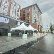 Load image into Gallery viewer, 60 Person tent rental package on concrete