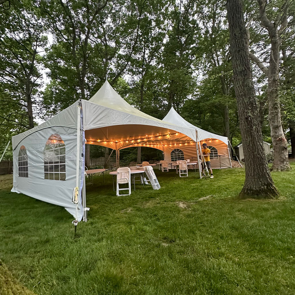 60 Person tent rental package with lights on