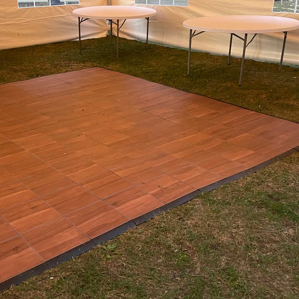 Closeup of 12x12 Dark Maple Dance Floor Rental from BZ Tent Rentals